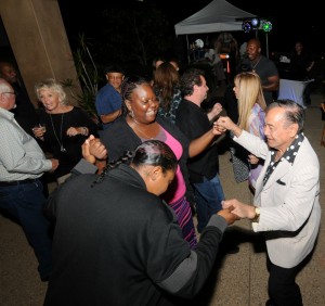 Camella and Richard Elliot dancing with partygoers (photo by David Hopley)
