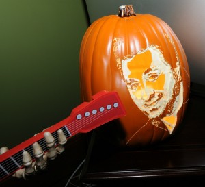 Guitar-playing monster serenading a pumpkin etched with Richard Elliot's face (Photo: David Hopley)