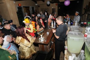 Halloween partygoers keep the bartender very busy (Photo: David Hopley)