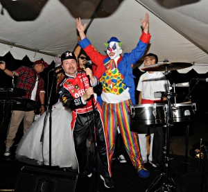 Richard Elliot, DW3 & clown onstage at the Elliot's Halloween Bash (Photo: David Hopley)